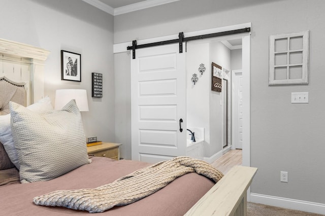 10009 Wildberry Dr, Waco, TX 76712 - bedroom featuring crown molding, a barn door, and baseboards