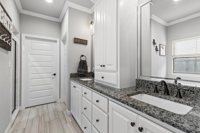 10009 Wildberry Dr, Waco, TX 76712 - bathroom with ornamental molding, double vanity, and a sink