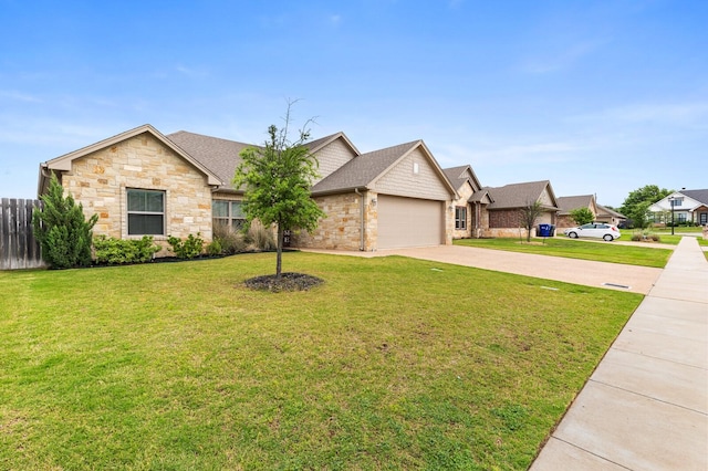10009 Wildberry Dr, Waco, TX 76712 - ranch-style home with fence, an attached garage, stone siding, driveway, and a front yard