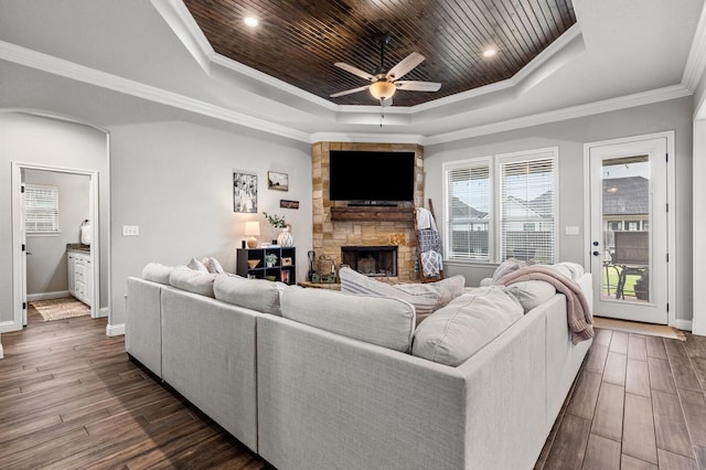 10009 Wildberry Dr, Waco, TX 76712 - living area featuring a tray ceiling, a ceiling fan, a healthy amount of sunlight, and dark wood-style floors