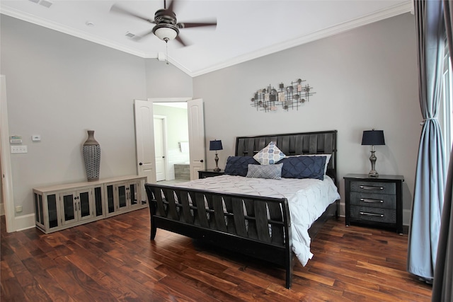 bedroom featuring lofted ceiling, ornamental molding, and wood finished floors