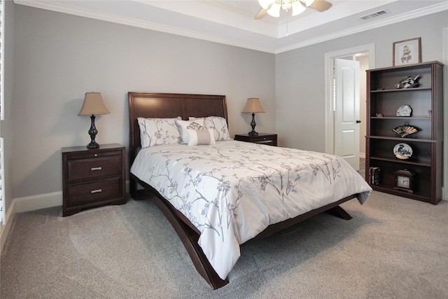 bedroom featuring carpet flooring, visible vents, baseboards, a ceiling fan, and ornamental molding