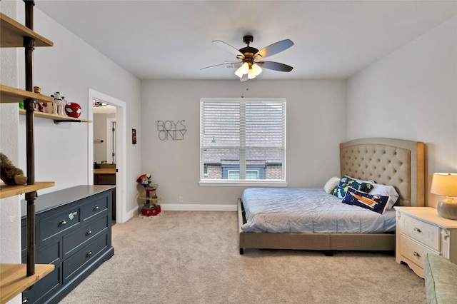 bedroom featuring baseboards, a ceiling fan, and light colored carpet