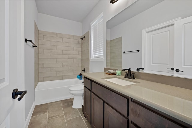 bathroom featuring bathtub / shower combination, vanity, tile patterned flooring, and toilet
