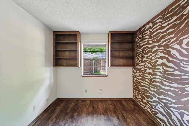 5112 River Ridge Rd, Arlington, TX 76017 - unfurnished room with wood finished floors, a textured ceiling, and baseboards