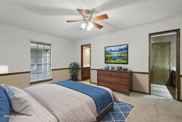 5112 River Ridge Rd, Arlington, TX 76017 - bedroom featuring light colored carpet, crown molding, ensuite bathroom, a ceiling fan, and baseboards