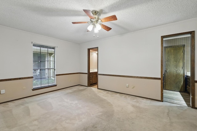 5112 River Ridge Rd, Arlington, TX 76017 - spare room with ornamental molding, carpet floors, a ceiling fan, a textured ceiling, and baseboards