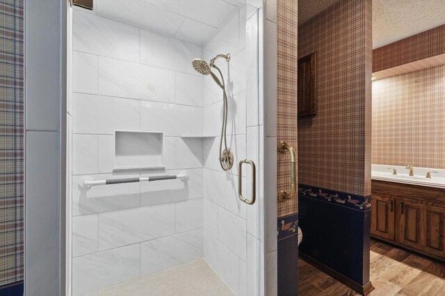 5112 River Ridge Rd, Arlington, TX 76017 - bathroom with a stall shower, wood finished floors, and vanity