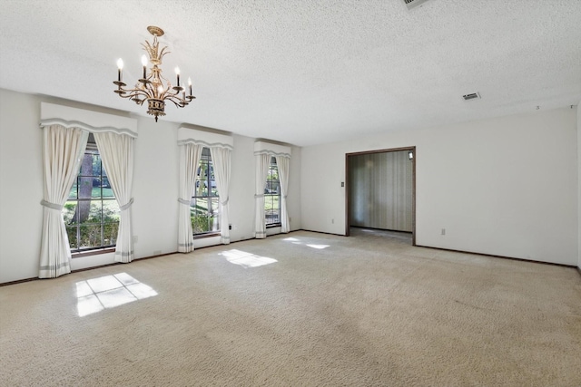 5112 River Ridge Rd, Arlington, TX 76017 - carpeted empty room with a textured ceiling, a chandelier, and baseboards
