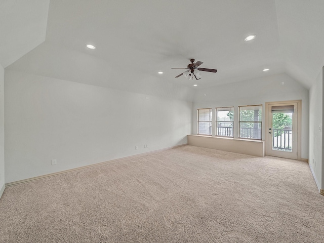 interior space featuring lofted ceiling, a ceiling fan, carpet flooring, and recessed lighting
