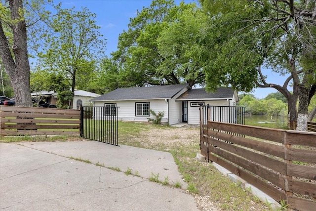 1125 Rodeo Center Blvd, Mesquite, TX 75149 - view of front facade featuring a gate and a water view