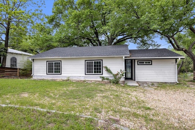 1125 Rodeo Center Blvd, Mesquite, TX 75149 - view of front of home featuring a front lawn and a shingled roof