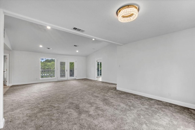 1125 Rodeo Center Blvd, Mesquite, TX 75149 - unfurnished living room with lofted ceiling, carpet floors, recessed lighting, french doors, and baseboards