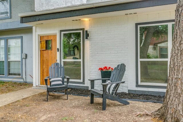 entrance to property with brick siding