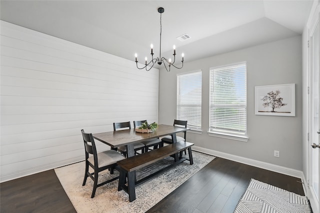 dining space with a chandelier, baseboards, dark wood-style flooring, and lofted ceiling