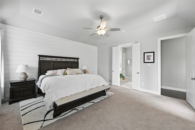 carpeted bedroom featuring ceiling fan and baseboards
