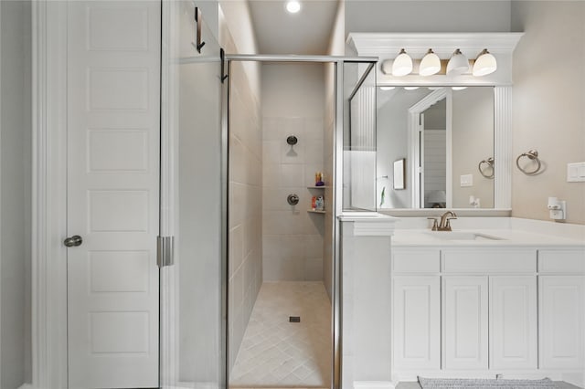 bathroom featuring a stall shower and vanity