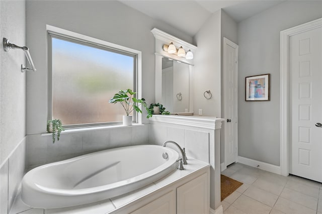 full bath featuring tile patterned floors and a garden tub