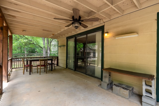 view of patio featuring a ceiling fan and outdoor dining area