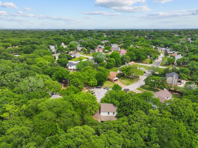 drone / aerial view featuring a forest view