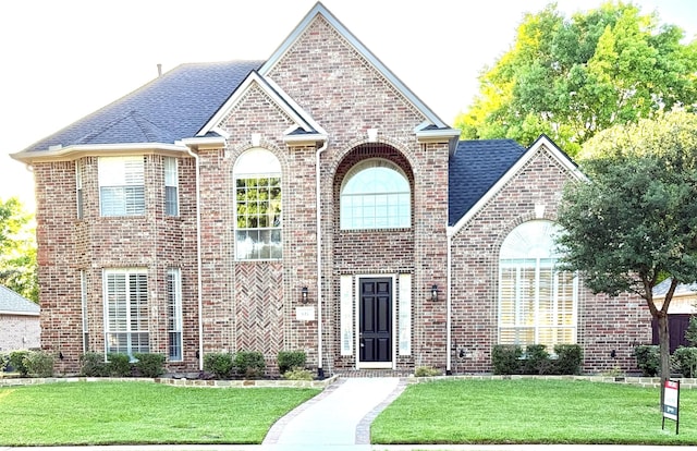611 Twin Creek Dr, Allen, TX 75013 - french provincial home featuring brick siding, a front yard, and a shingled roof
