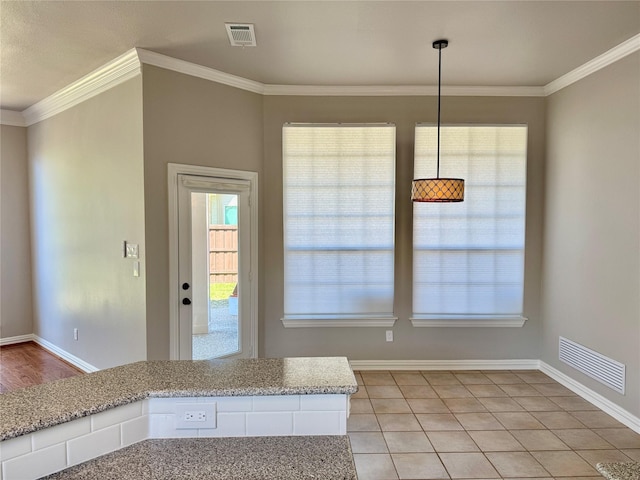 611 Twin Creek Dr, Allen, TX 75013 - unfurnished dining area with ornamental molding, baseboards, and light tile patterned flooring