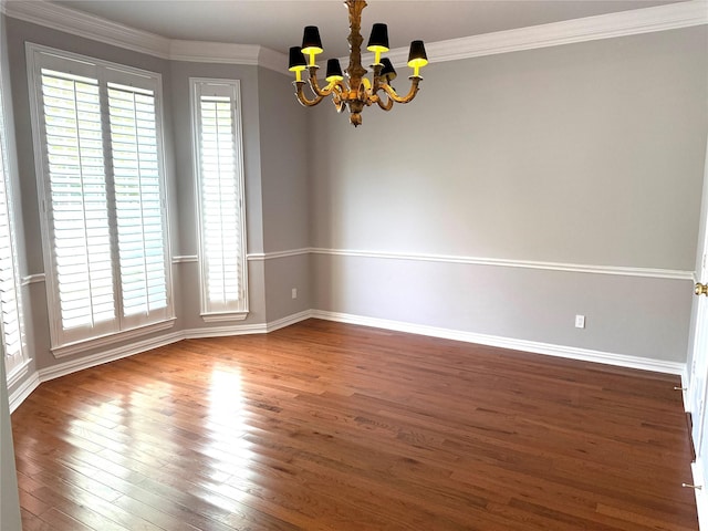 611 Twin Creek Dr, Allen, TX 75013 - spare room featuring a chandelier, wood finished floors, baseboards, and ornamental molding