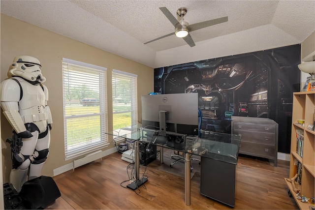 office area with a textured ceiling, a ceiling fan, wood finished floors, and baseboards
