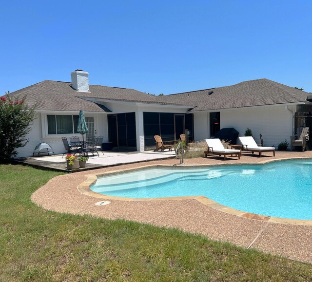 outdoor pool featuring a patio
