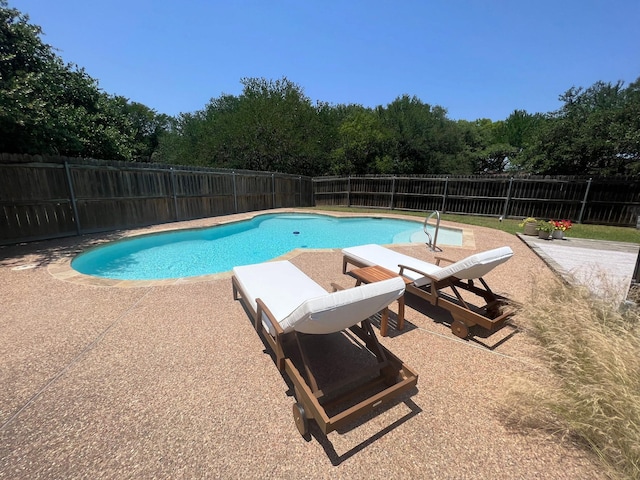 view of pool with a patio, a fenced backyard, and a fenced in pool