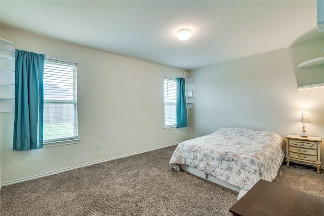 bedroom with baseboards and carpet flooring