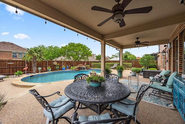 view of swimming pool featuring a patio area, a fenced backyard, a fenced in pool, and a ceiling fan