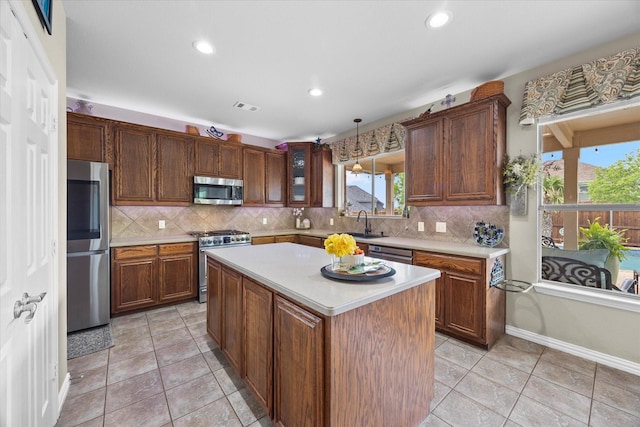 kitchen featuring light countertops, visible vents, a wealth of natural light, and appliances with stainless steel finishes