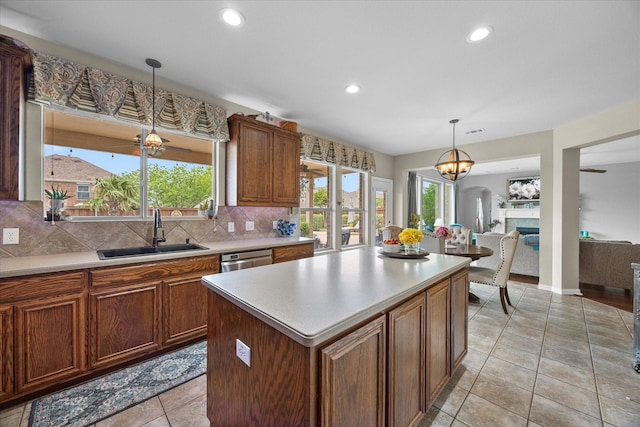 547 Reed Dr, Fate, TX 75087 - kitchen featuring a sink, a chandelier, tasteful backsplash, plenty of natural light, and recessed lighting