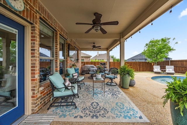 view of patio / terrace with a ceiling fan, a fenced in pool, outdoor dining area, and a fenced backyard