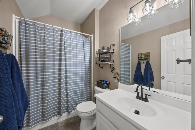 bathroom with vaulted ceiling, toilet, and vanity