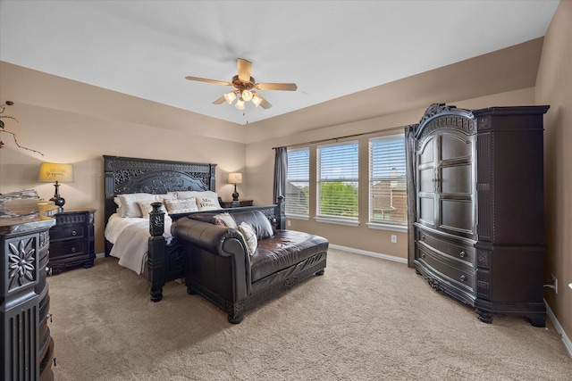 bedroom featuring a ceiling fan, baseboards, and light colored carpet