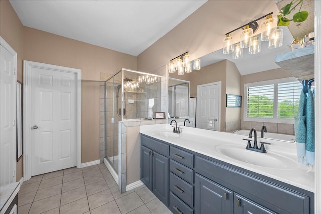 full bathroom featuring tile patterned flooring, an inviting chandelier, a sink, and a stall shower