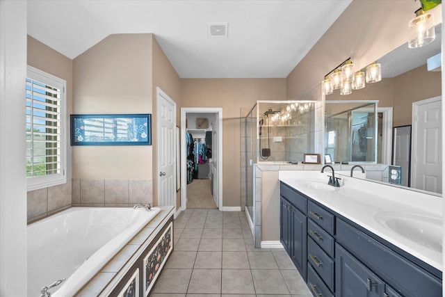 bathroom with visible vents, a sink, and a stall shower
