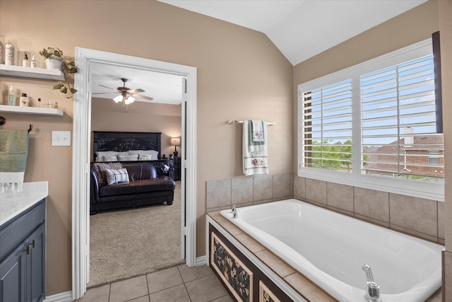 547 Reed Dr, Fate, TX 75087 - full bathroom featuring ensuite bathroom, tile patterned flooring, a garden tub, a ceiling fan, and vaulted ceiling