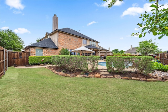 view of yard featuring a fenced backyard, a fenced in pool, and a gazebo