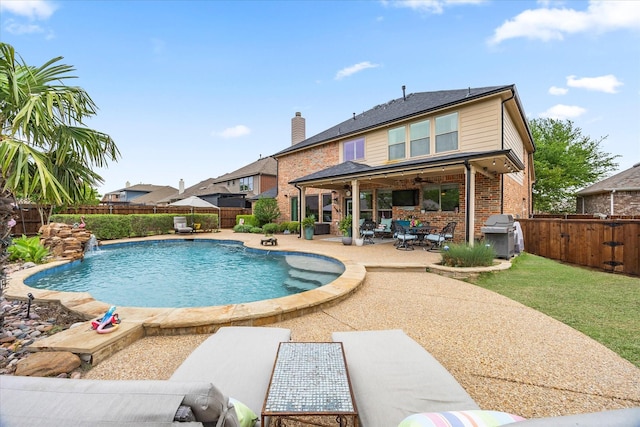 view of swimming pool featuring a patio area, a ceiling fan, a fenced backyard, a fenced in pool, and area for grilling