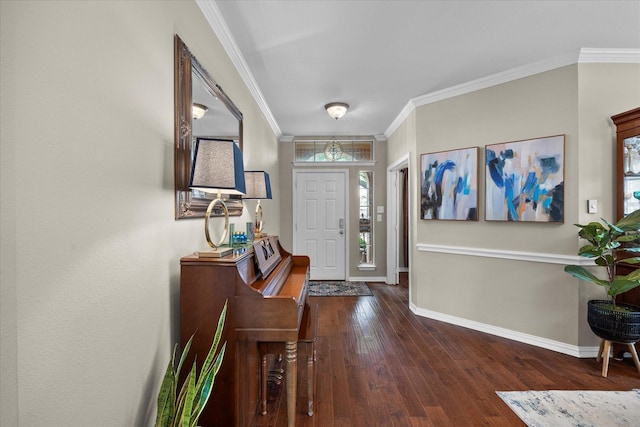 entrance foyer with wood-type flooring, baseboards, and ornamental molding
