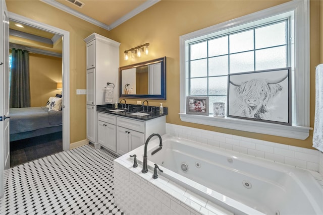 bathroom featuring ensuite bathroom, baseboards, a jetted tub, vanity, and ornamental molding