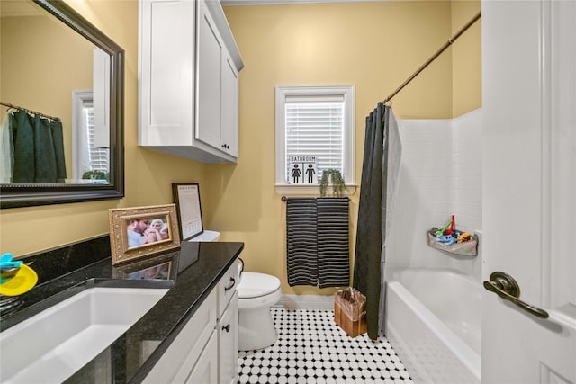 bathroom with vanity, toilet, baseboards, tile patterned flooring, and shower / bath combination with curtain
