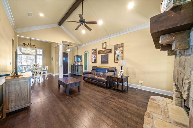 living room featuring arched walkways, dark wood finished floors, baseboards, ornate columns, and ceiling fan
