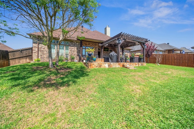 back of house with a lawn, a pergola, and brick siding