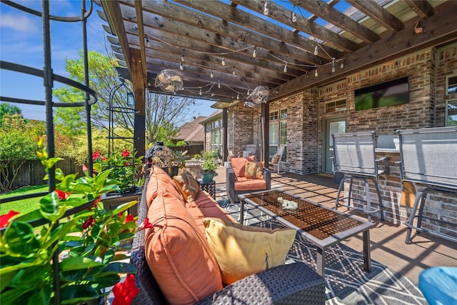 view of patio with fence, an outdoor living space, and a pergola