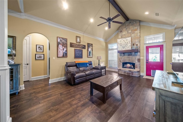 living room featuring ceiling fan, arched walkways, visible vents, a fireplace, and dark wood-style floors