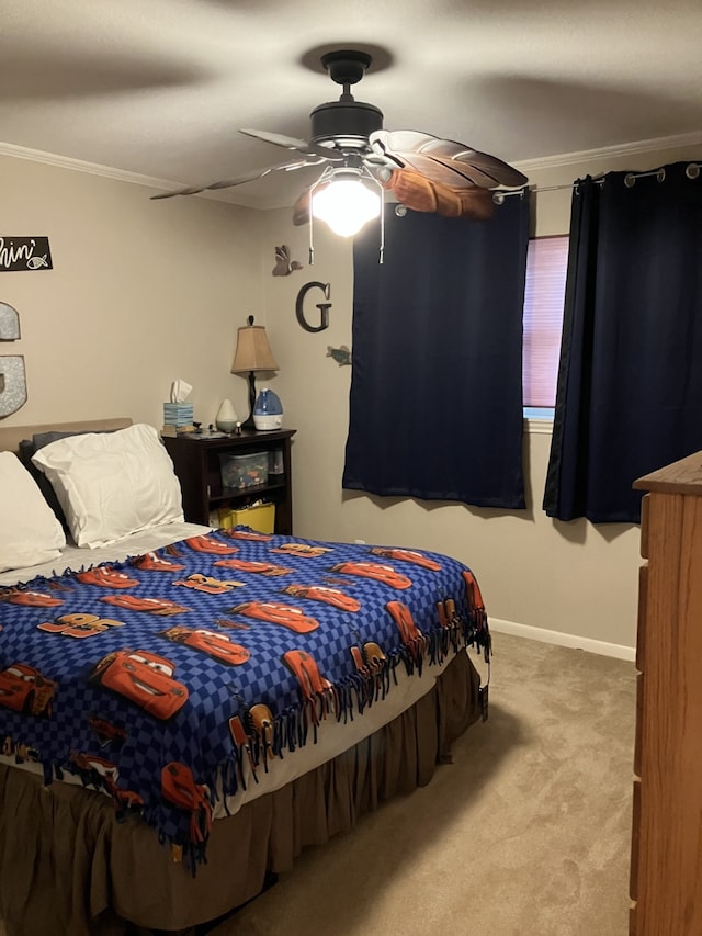 bedroom with a ceiling fan, baseboards, crown molding, and carpet
